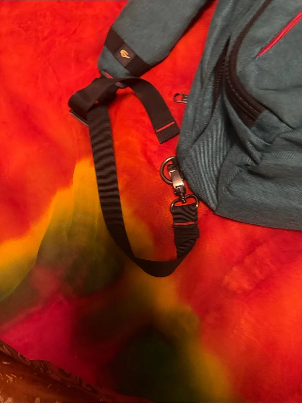 Teal Sling Backpack with Red Accent